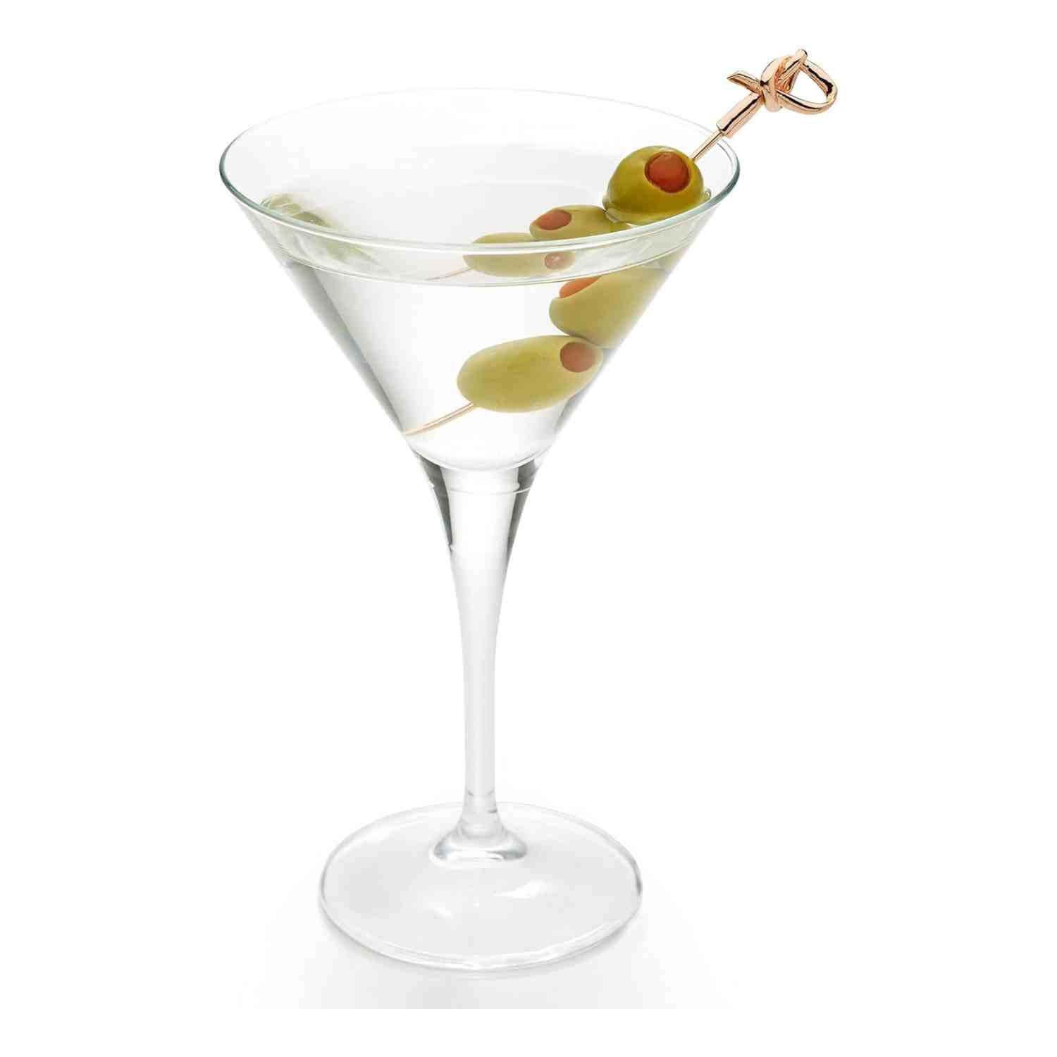 A clear martini in a stemmed glass, garnished with green olives skewered on a 4.5 inch Copper Plated Barfly Cocktail Pick, with a Bamboo Knot top.