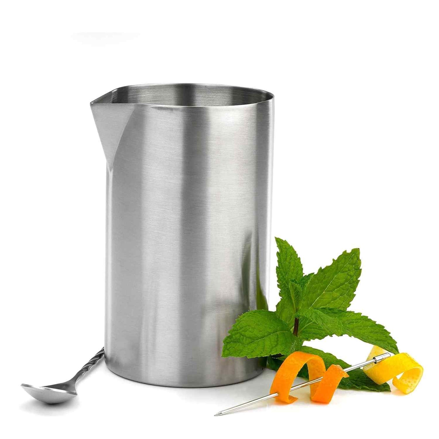 A Barfly Stainless Steel Double Wall Mixing Tin 21oz (625ml) shown next to  a bar spoon, a sprig of mint, and a cocktail pick spearing orange and lemon peels on a white background 