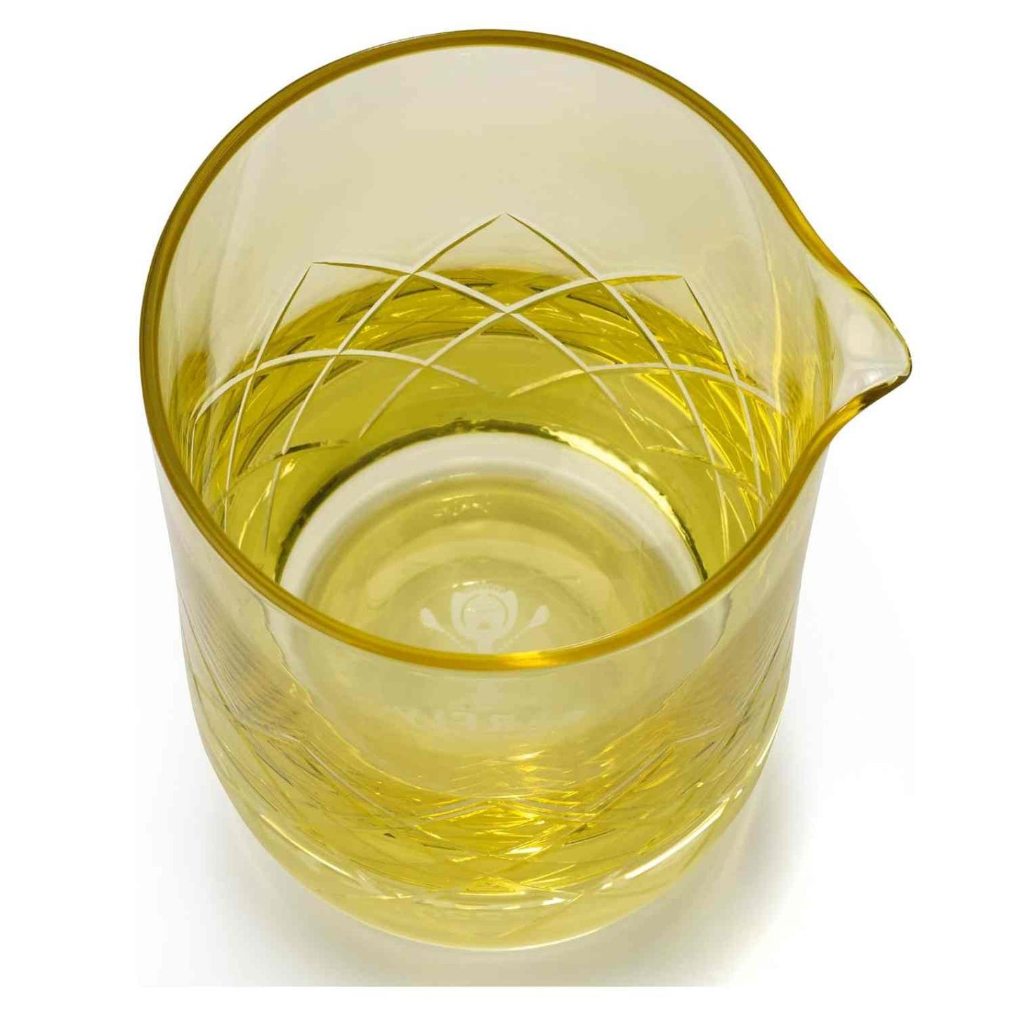 A close-up of the Gold Barfly Mixing Glass 17oz (500 ml) with geometric patterns on a white background