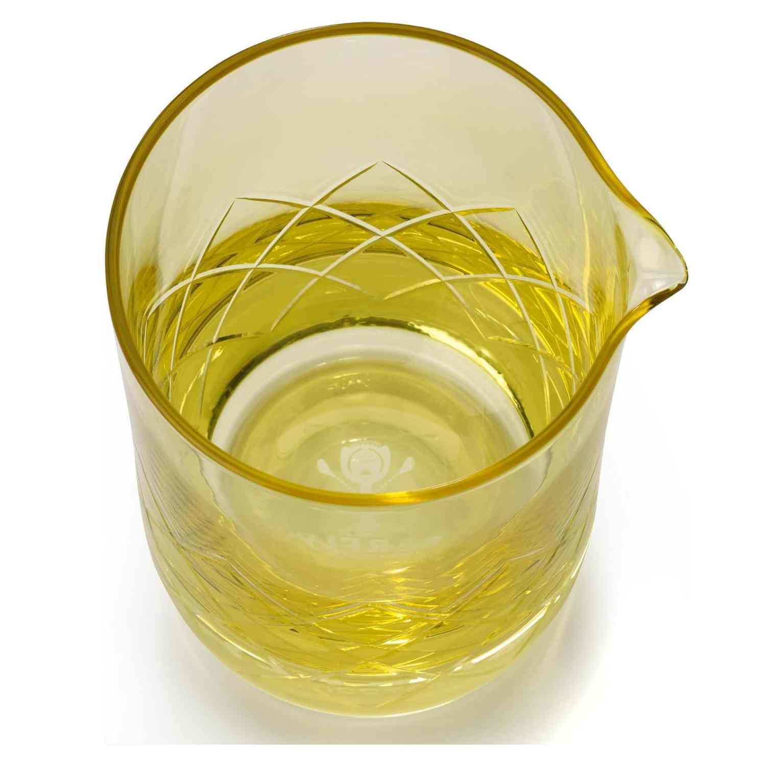 A close-up of the Gold Barfly Mixing Glass 17oz (500 ml) with geometric patterns on a white background
