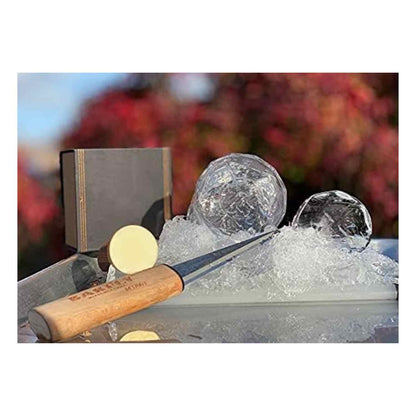 A Barfly Beech Wood Tapered Ice Pick, and an Ice ball maker with ice cubes and a book in the background