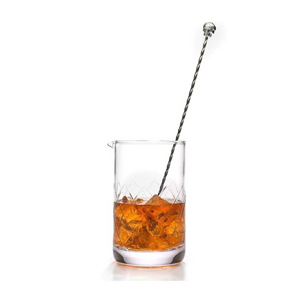 A Barfly Drink Mixing Glass, 24oz, 700ml  with cocktail ingredients and ice cubes, stirred with a metal stirrer on a white background