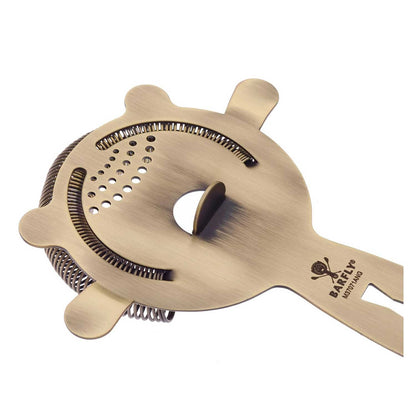 An Antique Gold Barfly Heavy-Duty 4 Prong Spring Bar Strainer on a white background