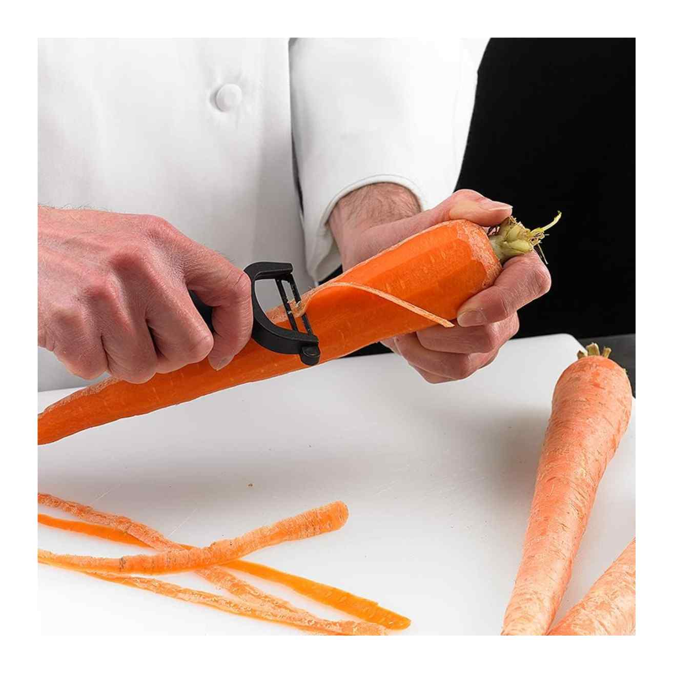 Person peeling a carrot with a Black Mercer Culinary Y Swiss Peeler on a white surface